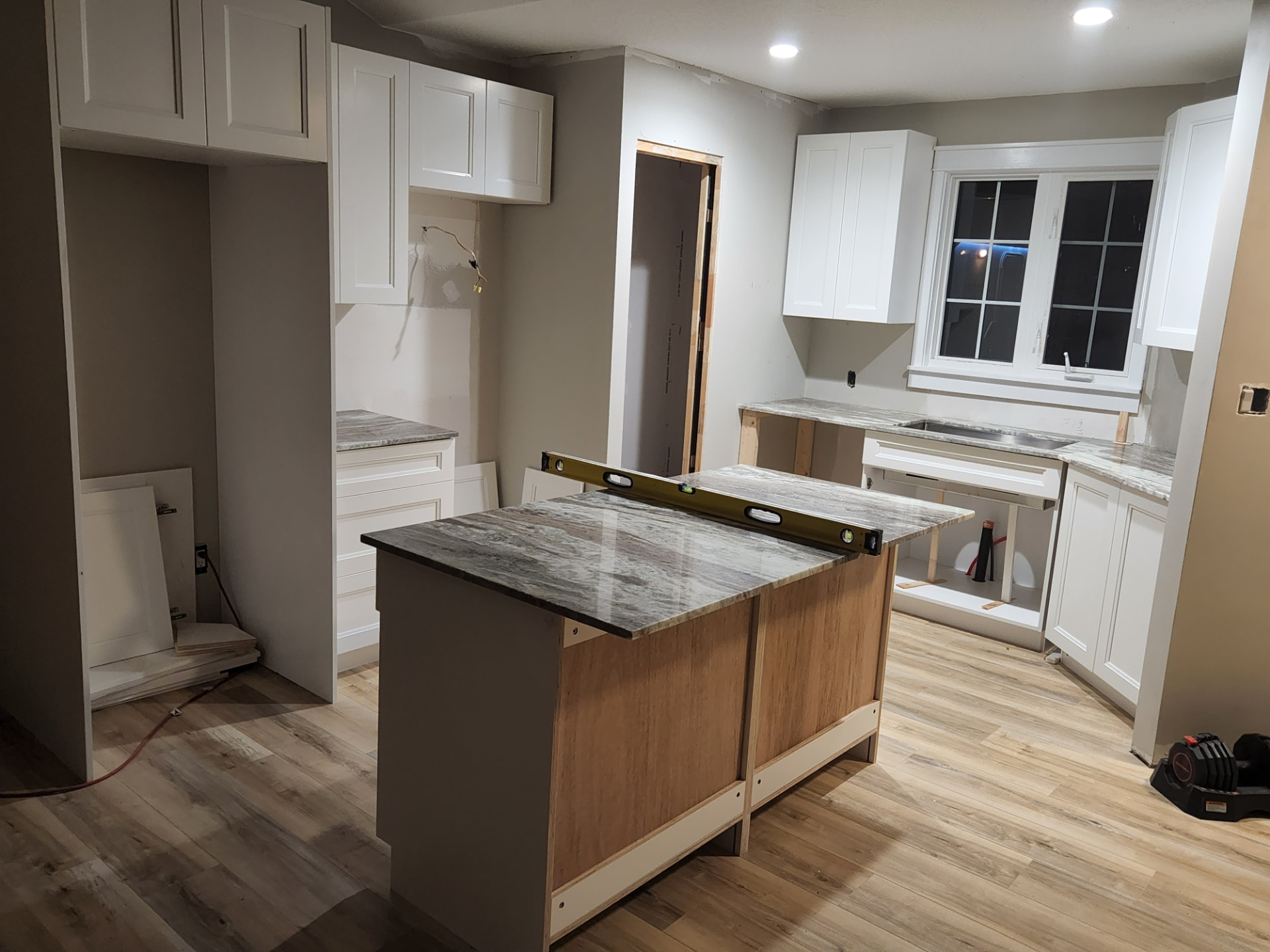 Island box framed and countertop set in place before panelling and paint